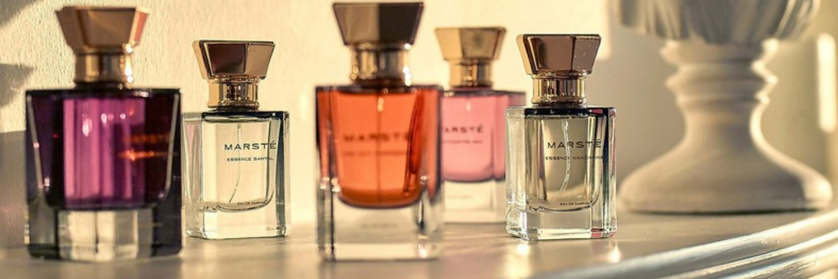 House of Marsté fragrances lined up on a sunlit mantel